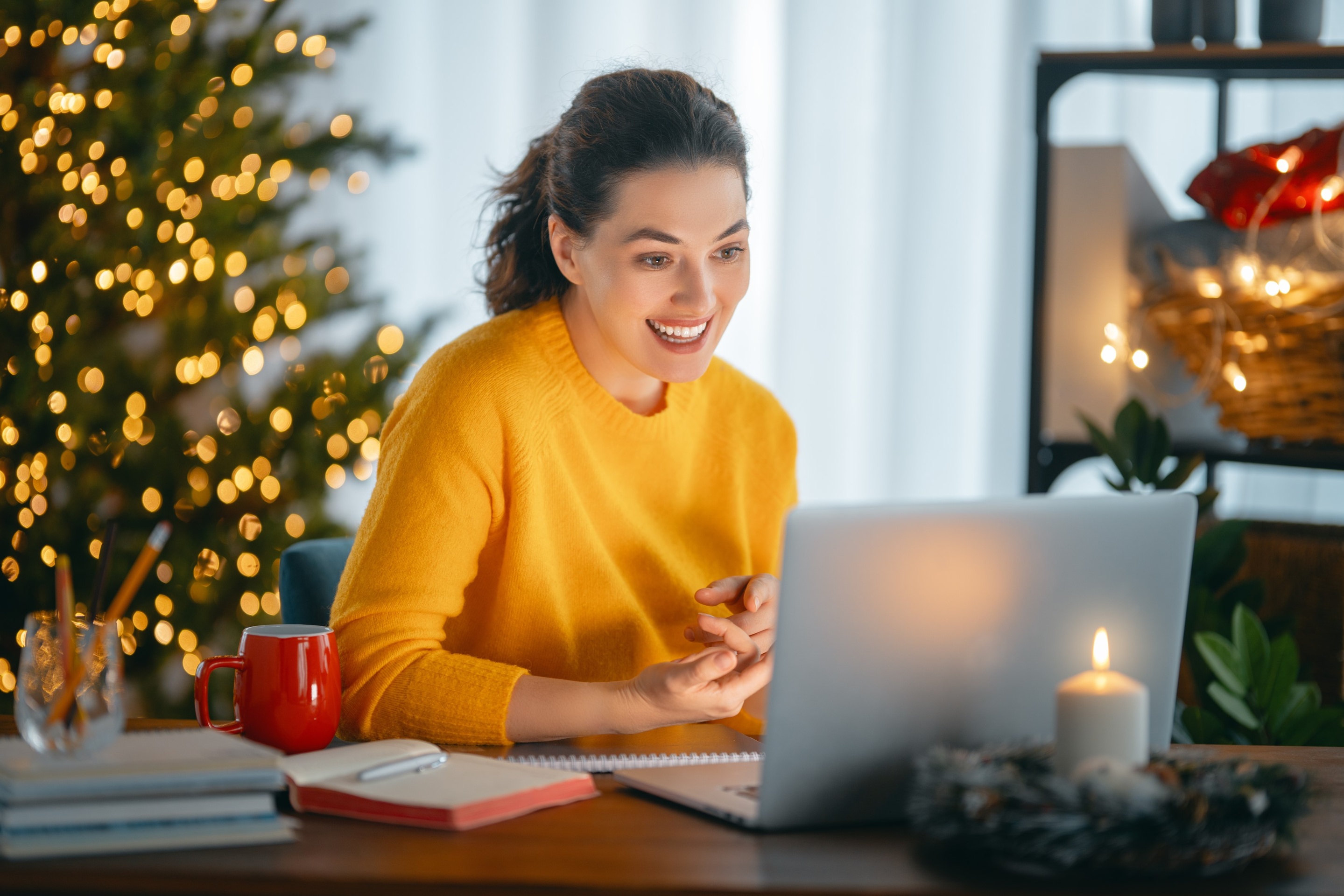 Woman working in home office before Christmas